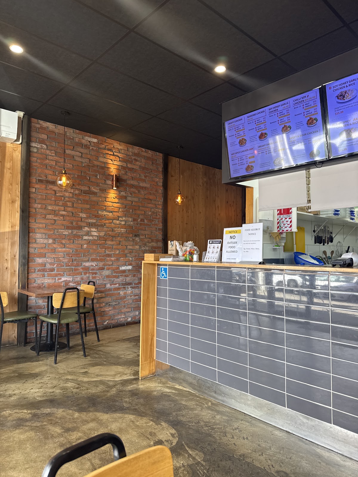The order counter and menu boards at Papas Chicken