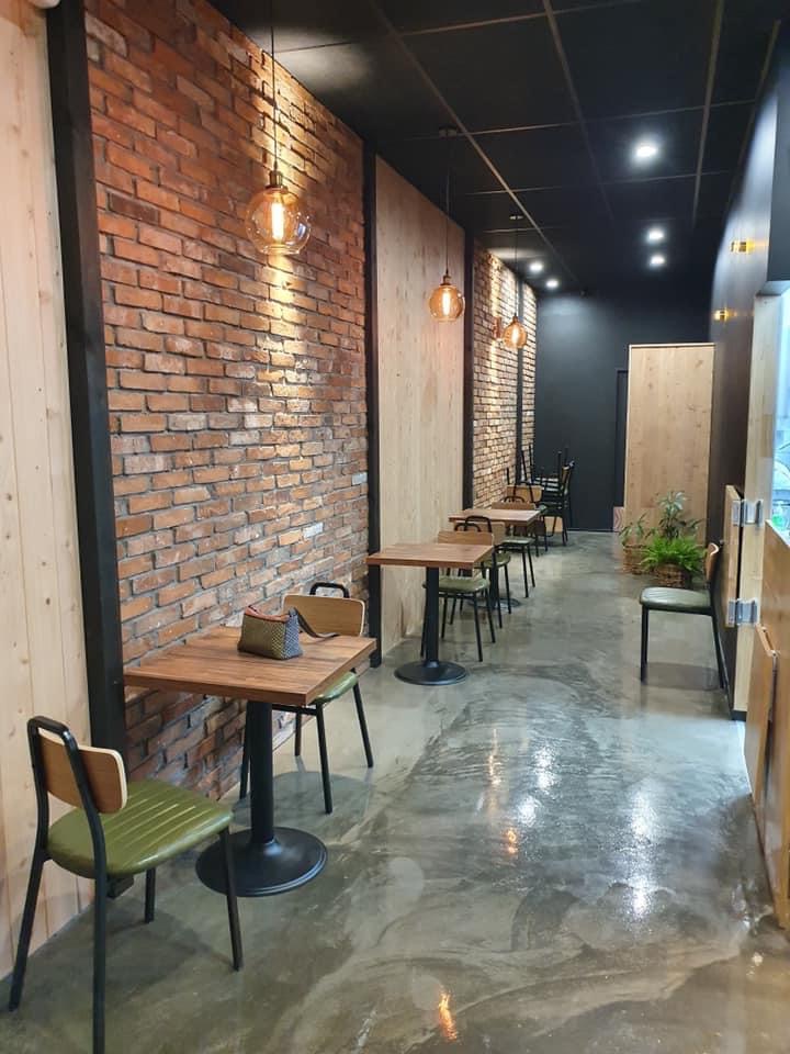 Papas Chicken dining room with exposed brick and timber tables